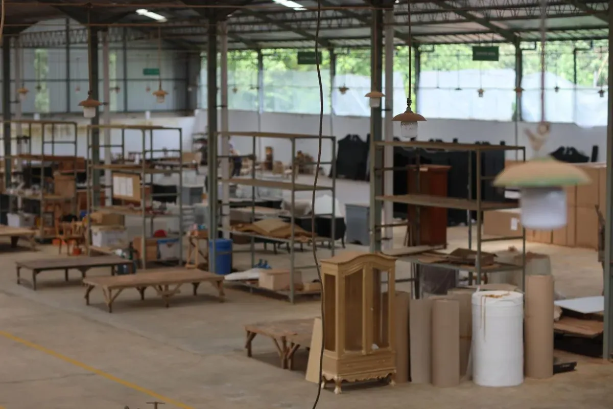 Wood furniture workshop with shelves and materials