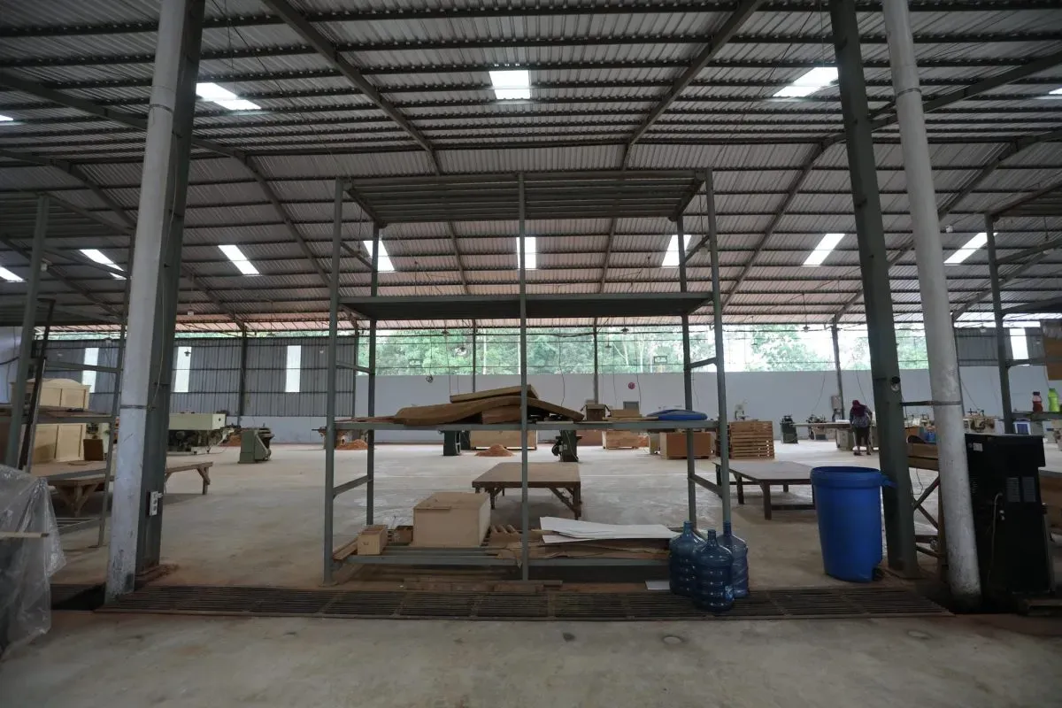 Spacious industrial warehouse with equipment and materials