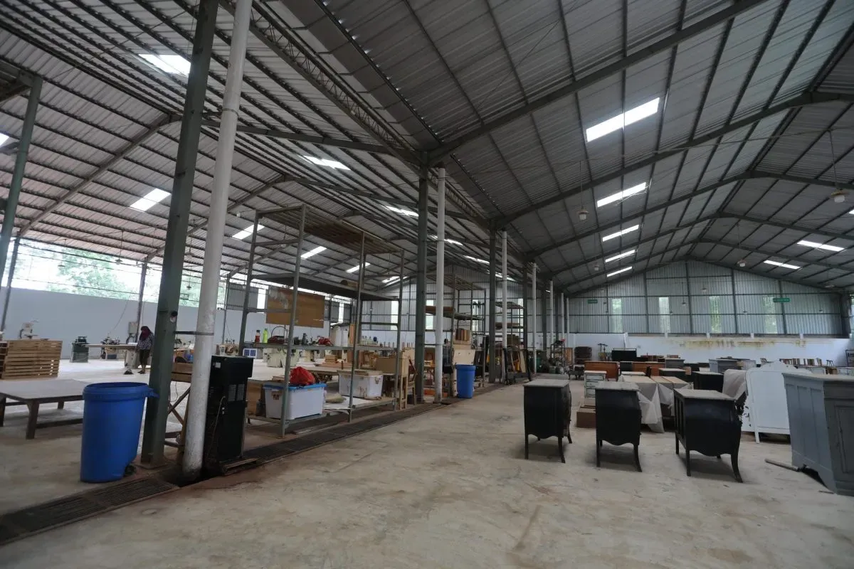 Spacious furniture workshop with wooden materials inside