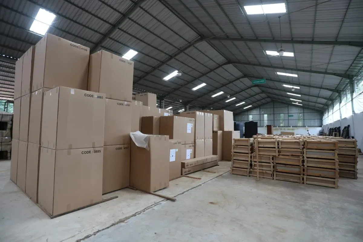 Large warehouse filled with stacked cardboard boxes