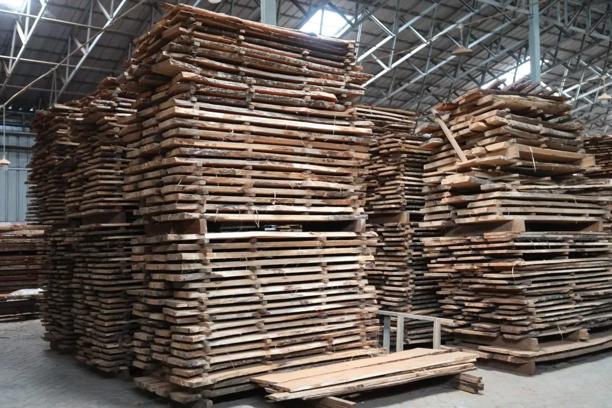 Stacks of wooden planks in lumber warehouse