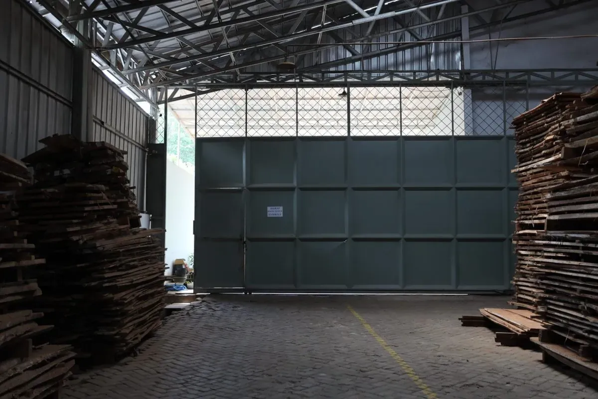 Stacks of wooden planks inside warehouse