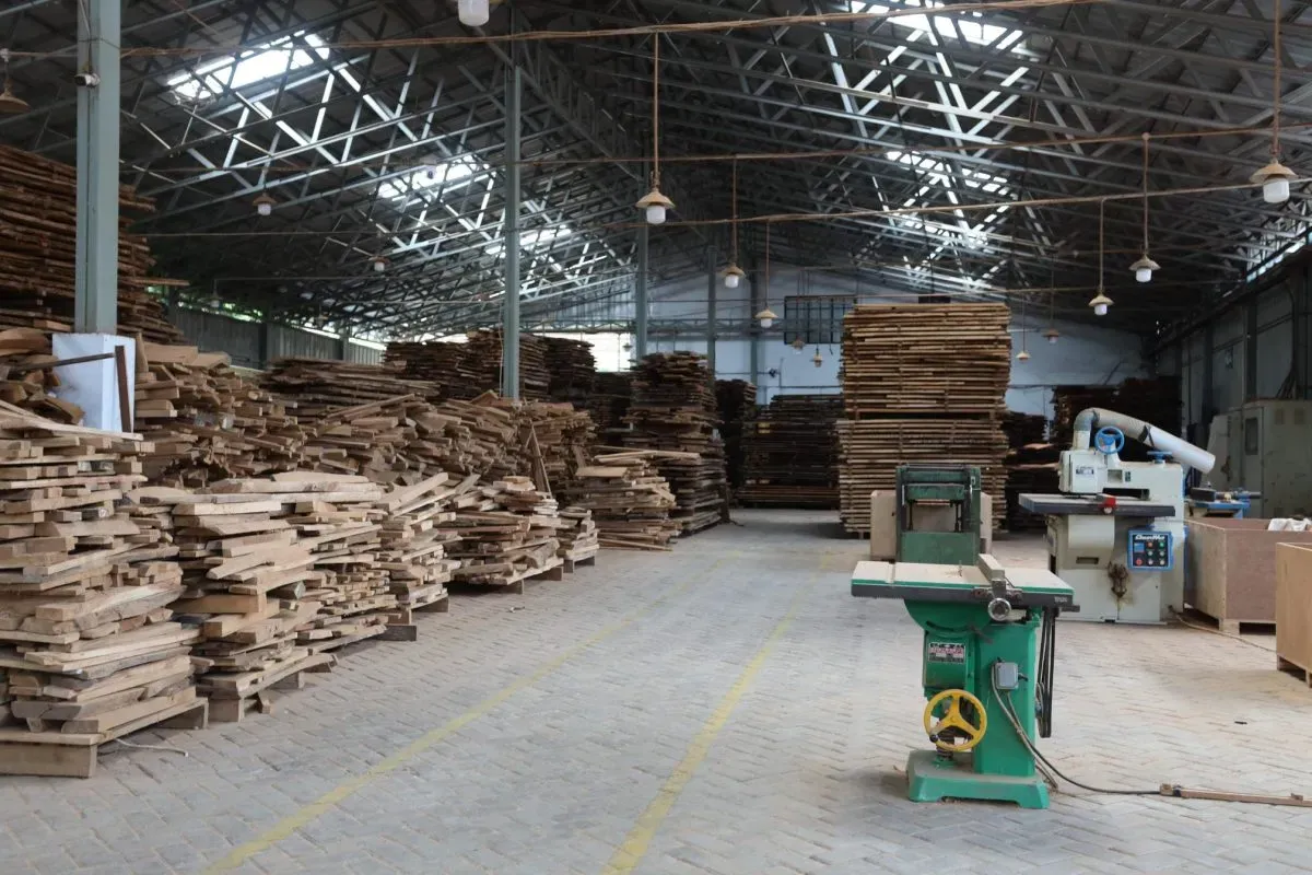 Woodworking factory with stacked lumber and machinery