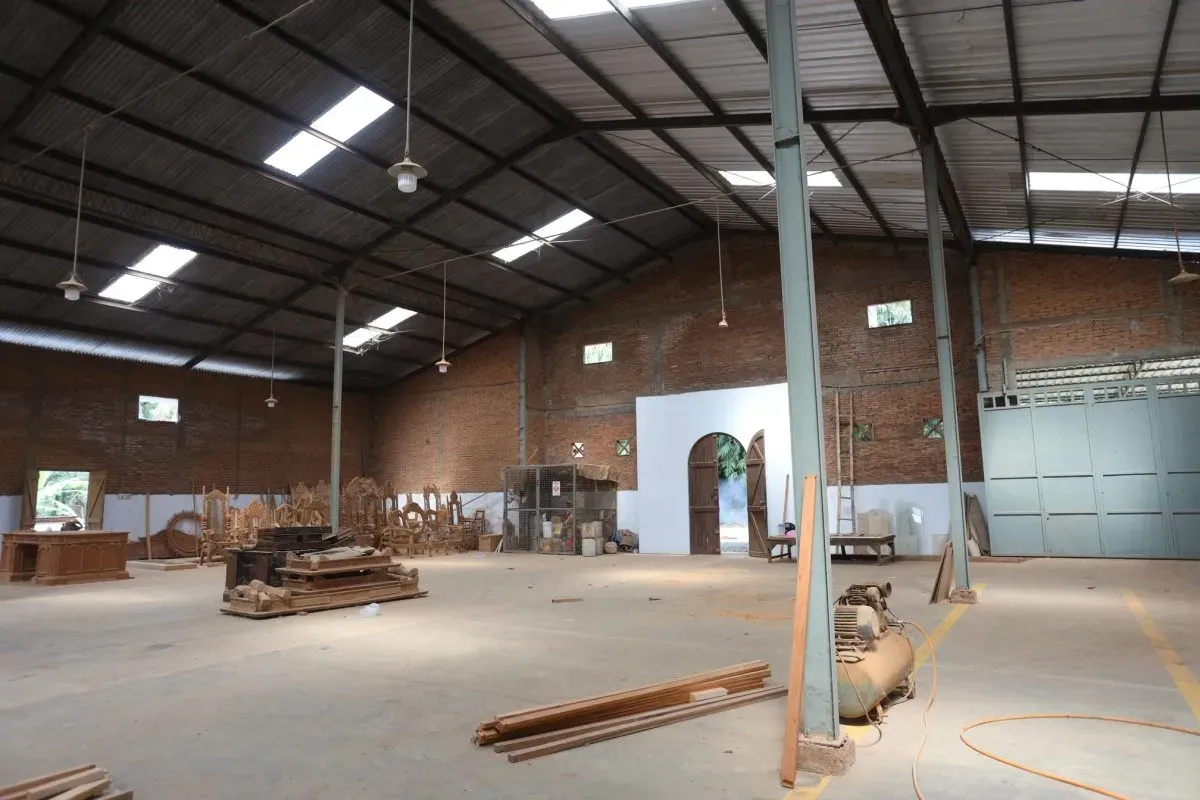 Spacious woodworking workshop with tools and wooden furniture