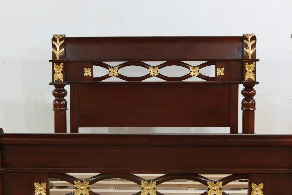 Wooden bed frame with gold floral accents