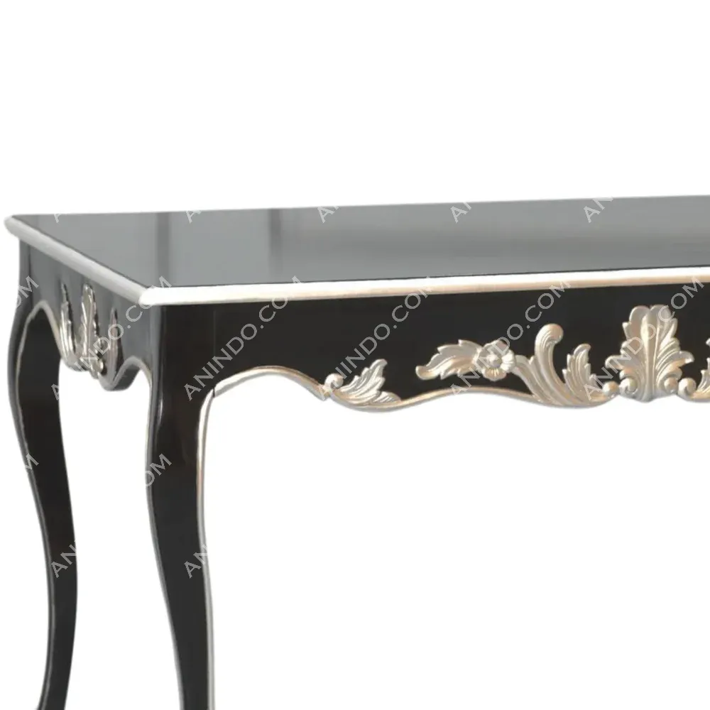 Black table with silver floral carvings