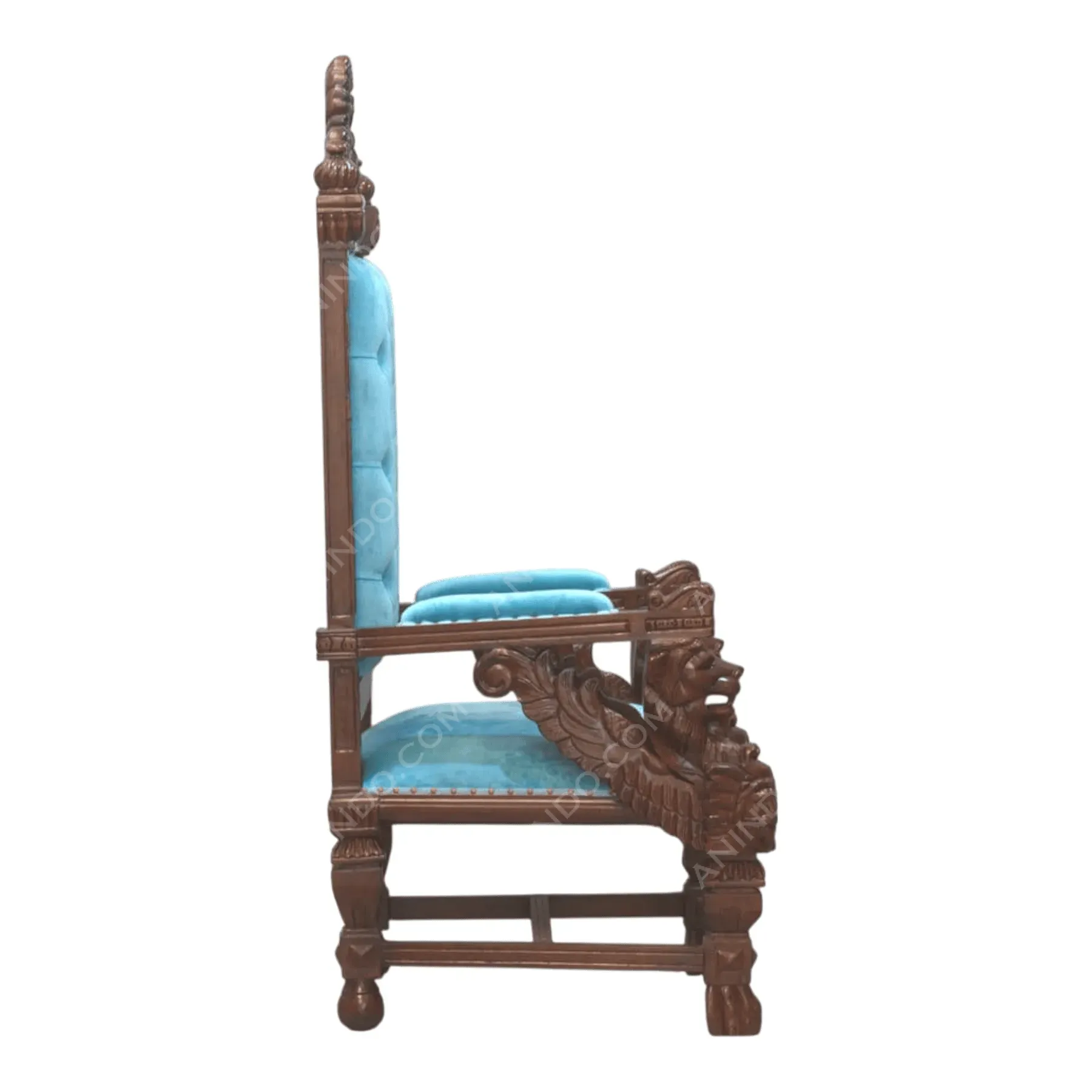 Ornate wooden chair with blue velvet upholstery