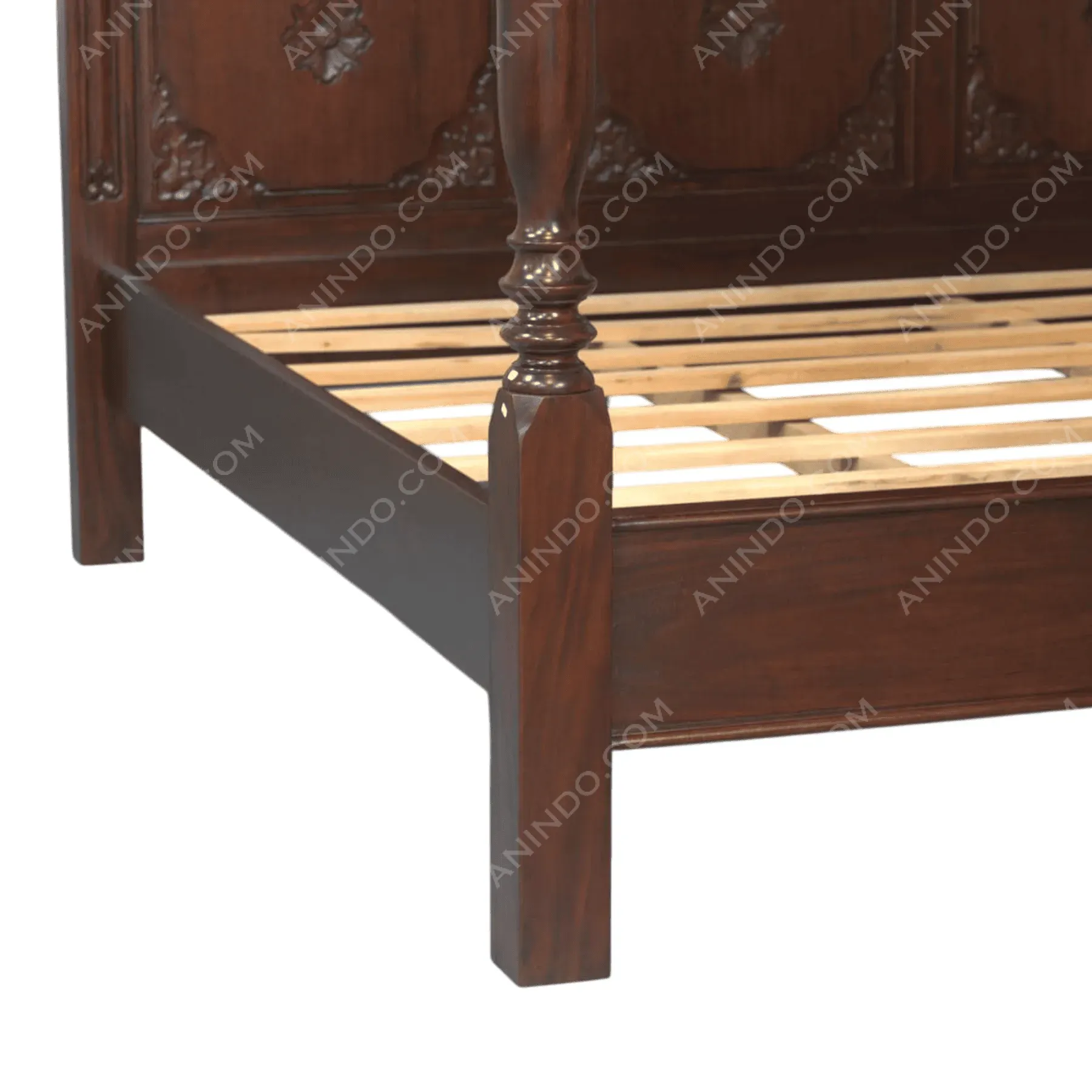 Close-up of wooden carved bed frame corner