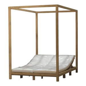 Wooden canopy bed with white cushions.