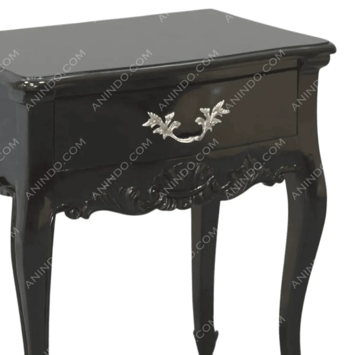 Elegant black nightstand with ornate drawer handle.