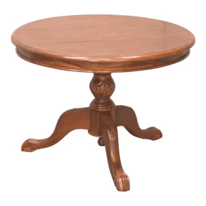 Round wooden table with ornate legs
