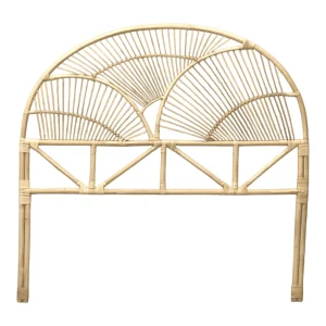 Rattan headboard with fan-shaped design.