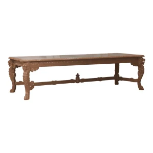 Elegant wooden dining table with intricate carvings.