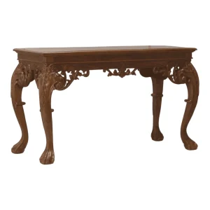 Elegant wooden table with ornate legs.