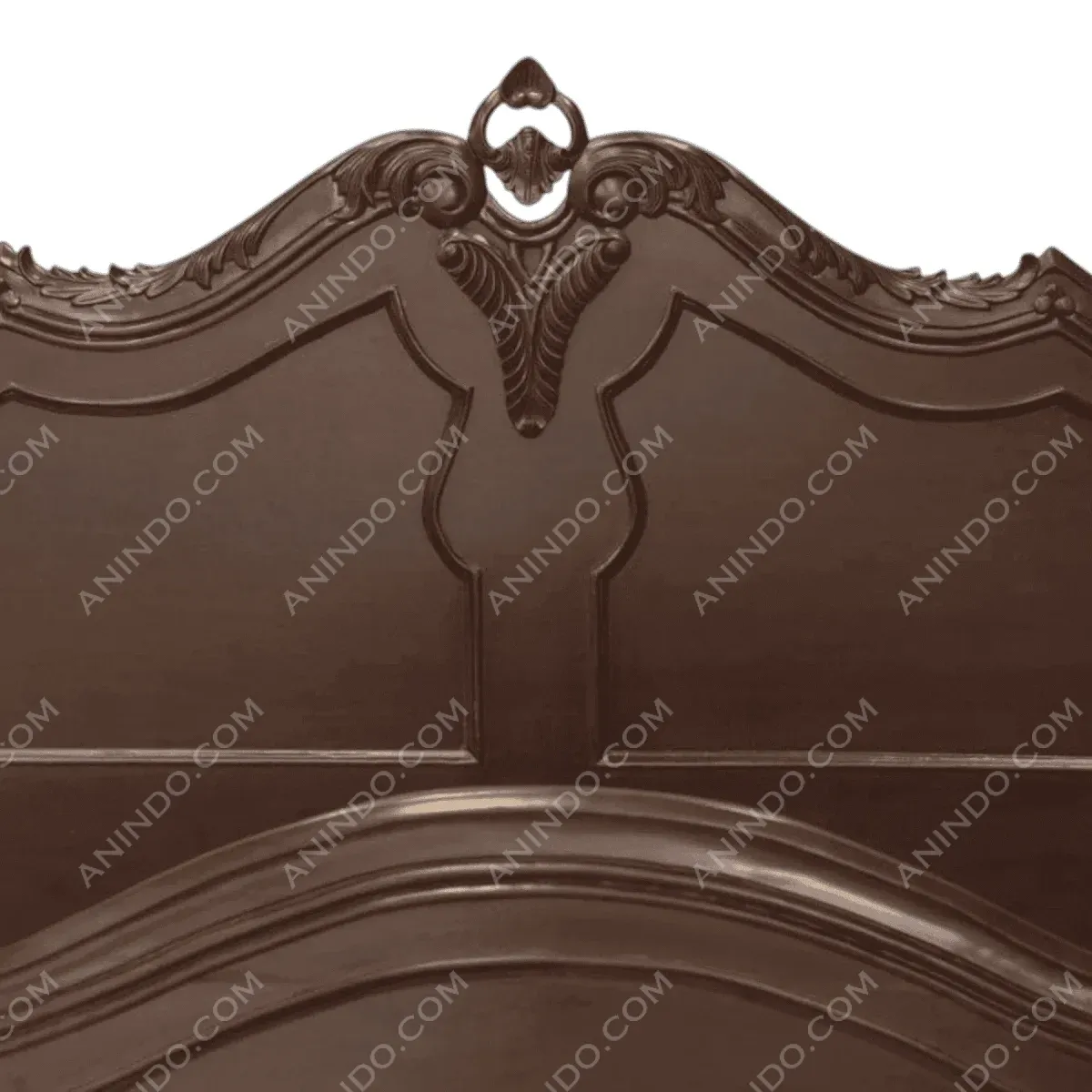 Intricate wooden headboard with ornate design.
