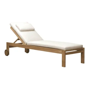 Wooden lounge chair with white cushions