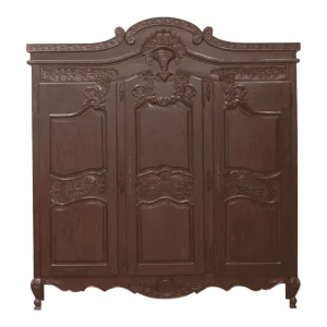 Ornate wooden wardrobe with detailed carvings