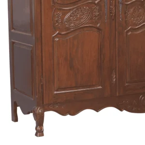 Detailed wooden cabinet with ornate carvings.
