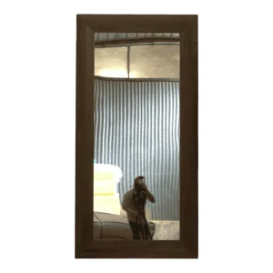 Reflective mirror in wooden frame.