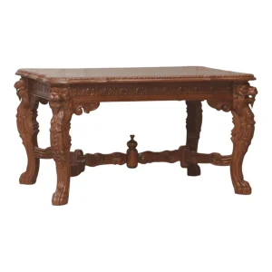 Intricately carved wooden table with decorative legs.