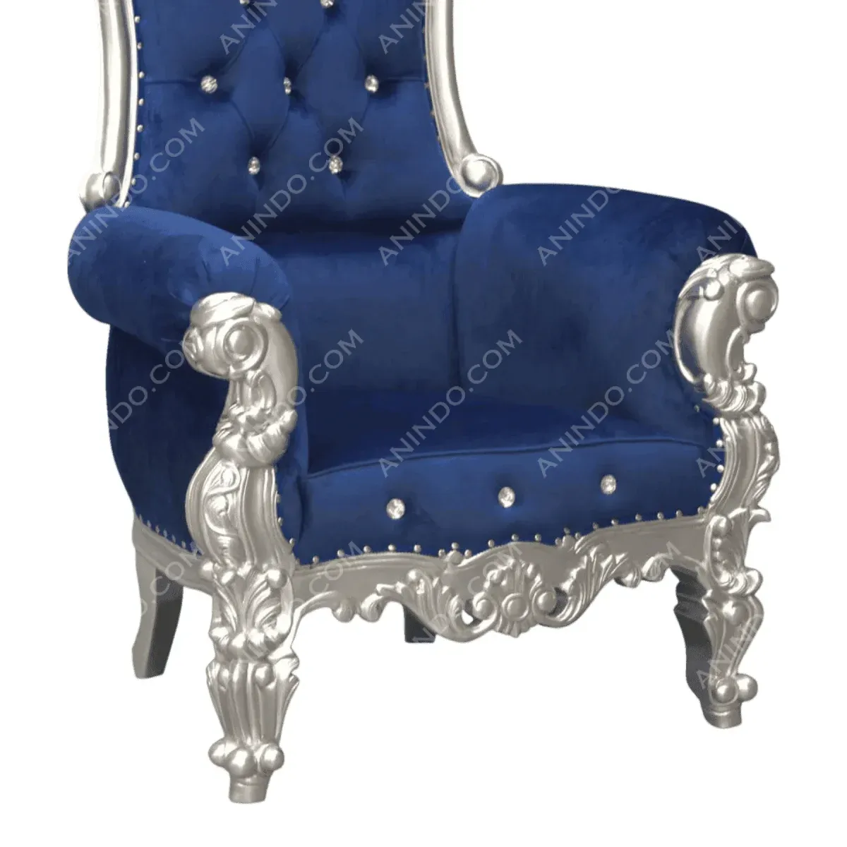 Luxurious blue velvet chair with ornate silver legs.
