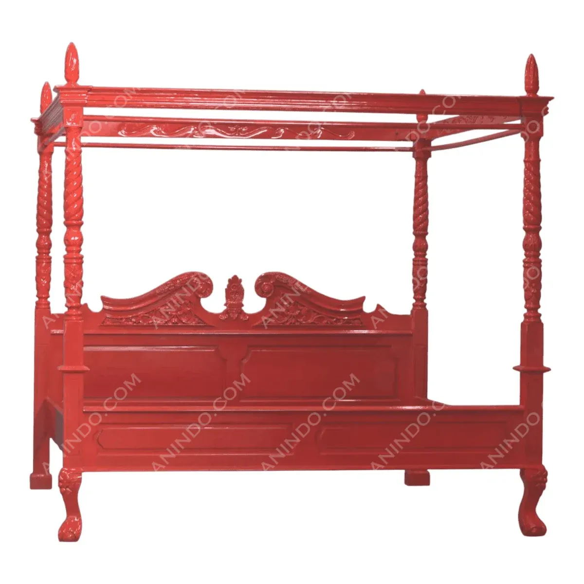 Elegant red canopy bed with detailed carvings.