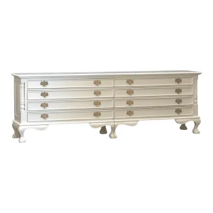 Elegant white dresser with multiple drawers.