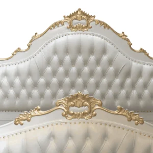 Elegant white and gold tufted headboard design.