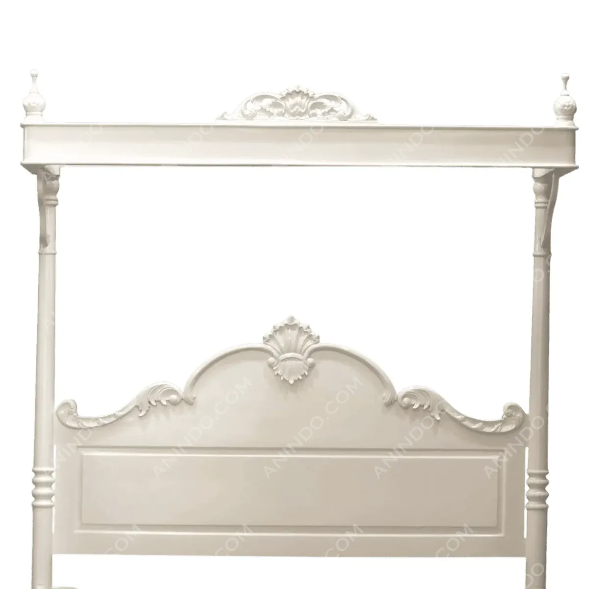 Elegant white four-poster bed with ornate details.