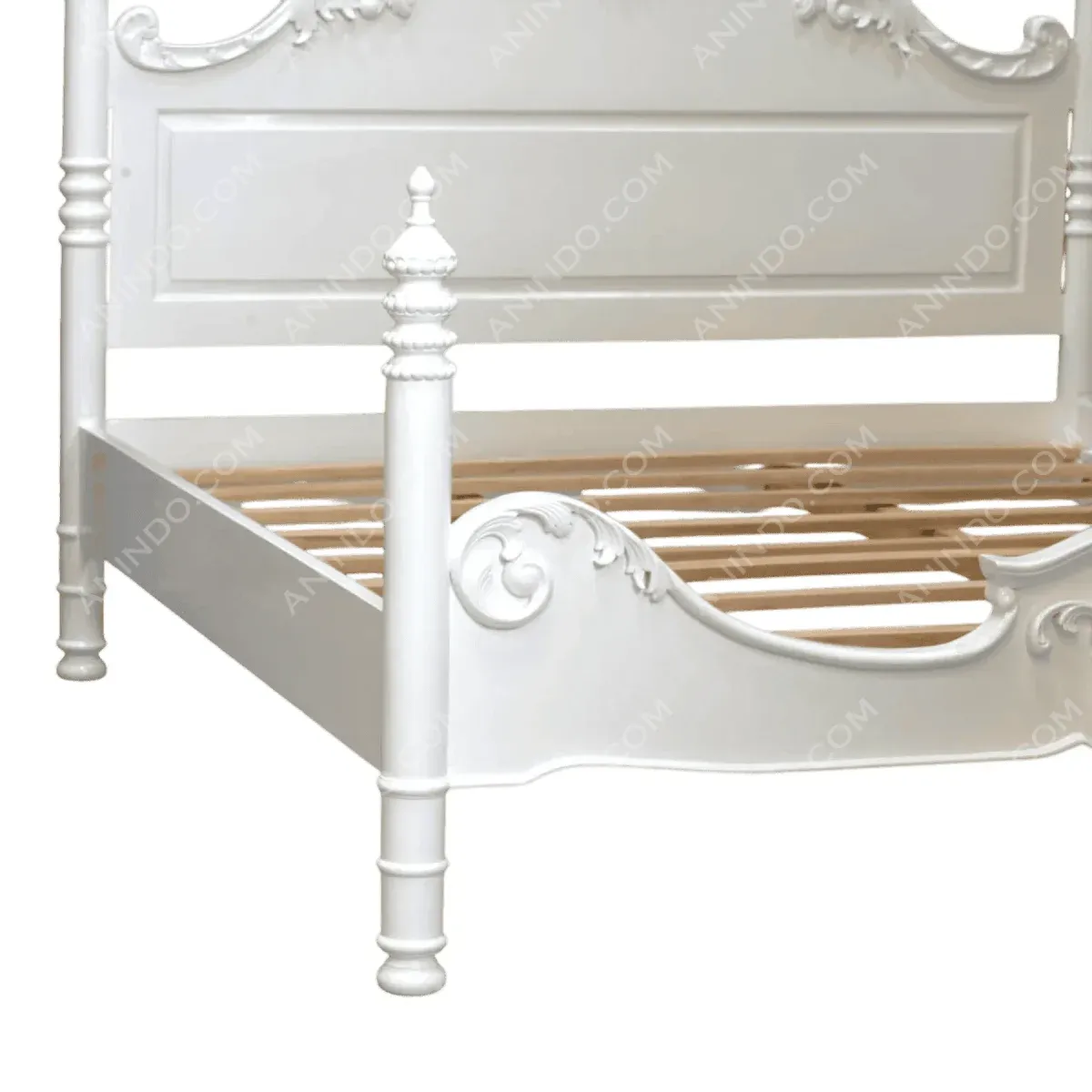 Elegant white wooden bed frame with ornate details.