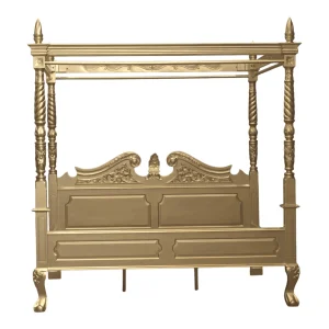 Elegant golden four-poster bed with intricate details