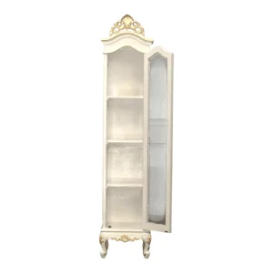 Elegant white cabinet with gold accents and shelves.