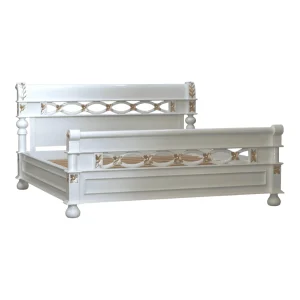 Elegant white bed with decorative carvings
