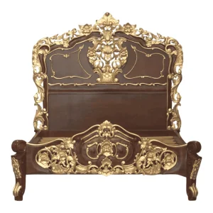 Intricately carved wooden bed with gold accents.