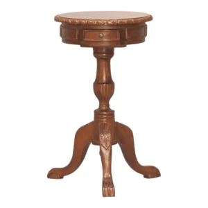 Round wooden side table with carved details.