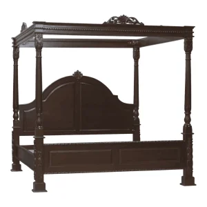 Elegant wooden four-poster bed with intricate design.