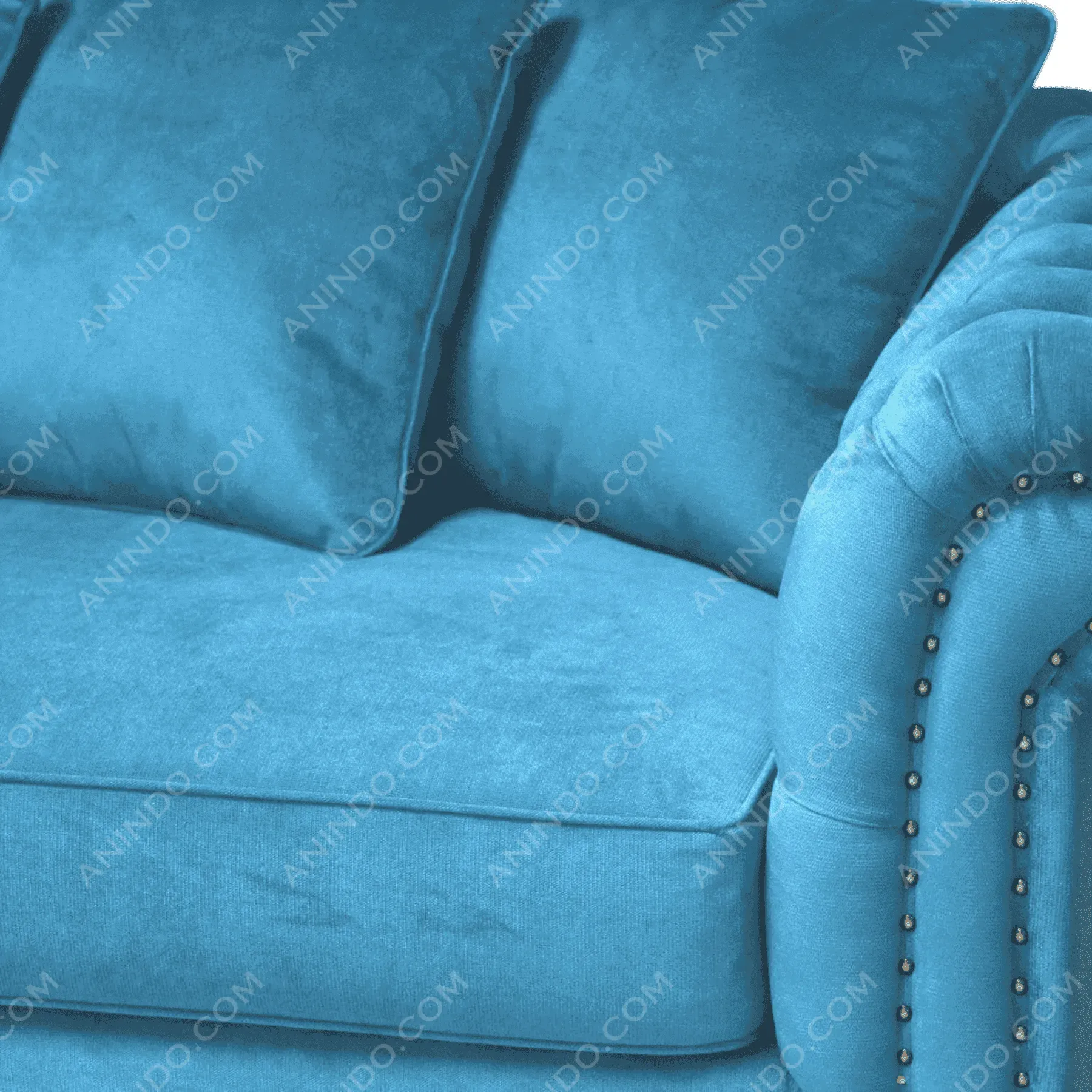 Blue velvet sofa with cushions