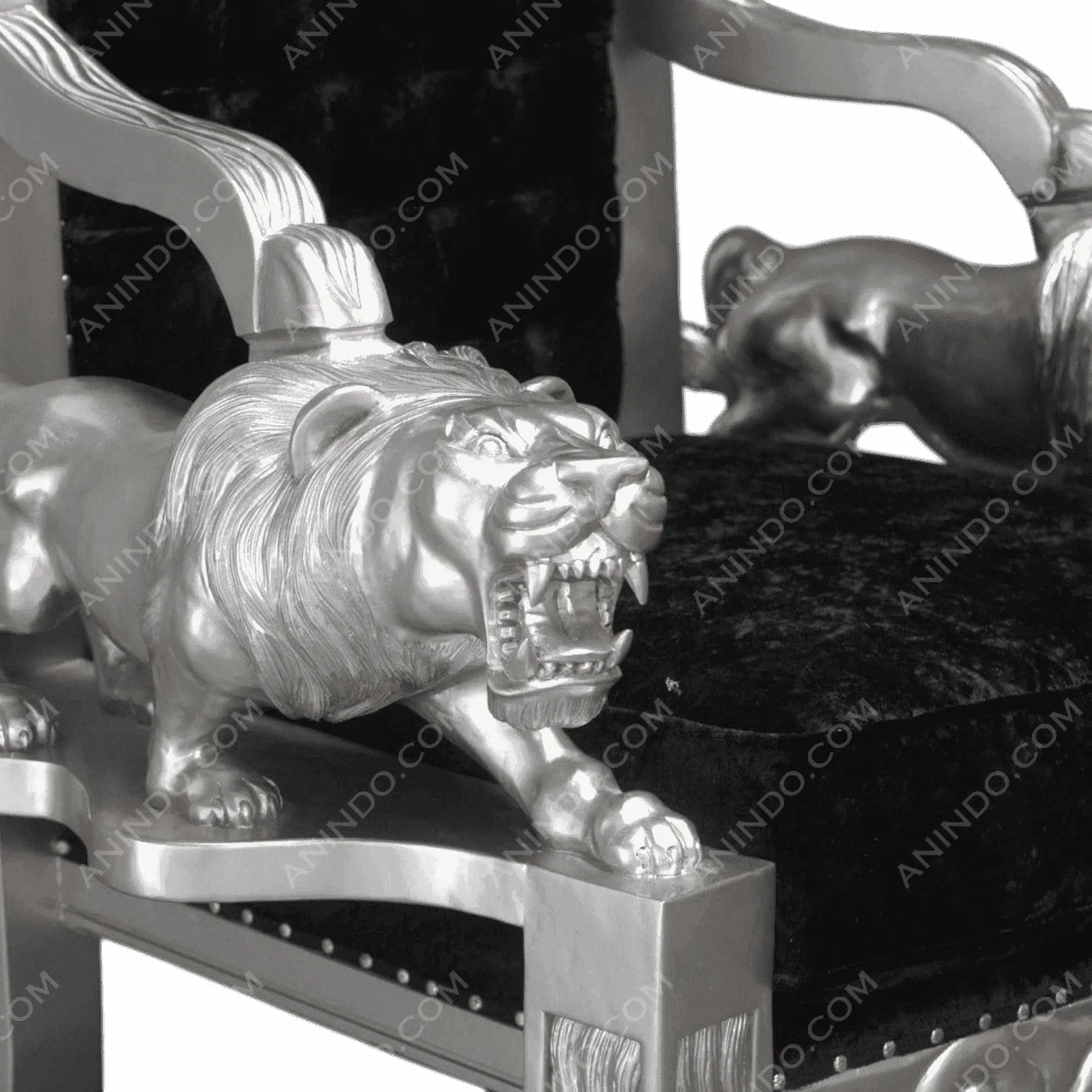 Silver lion armchair with black velvet seat