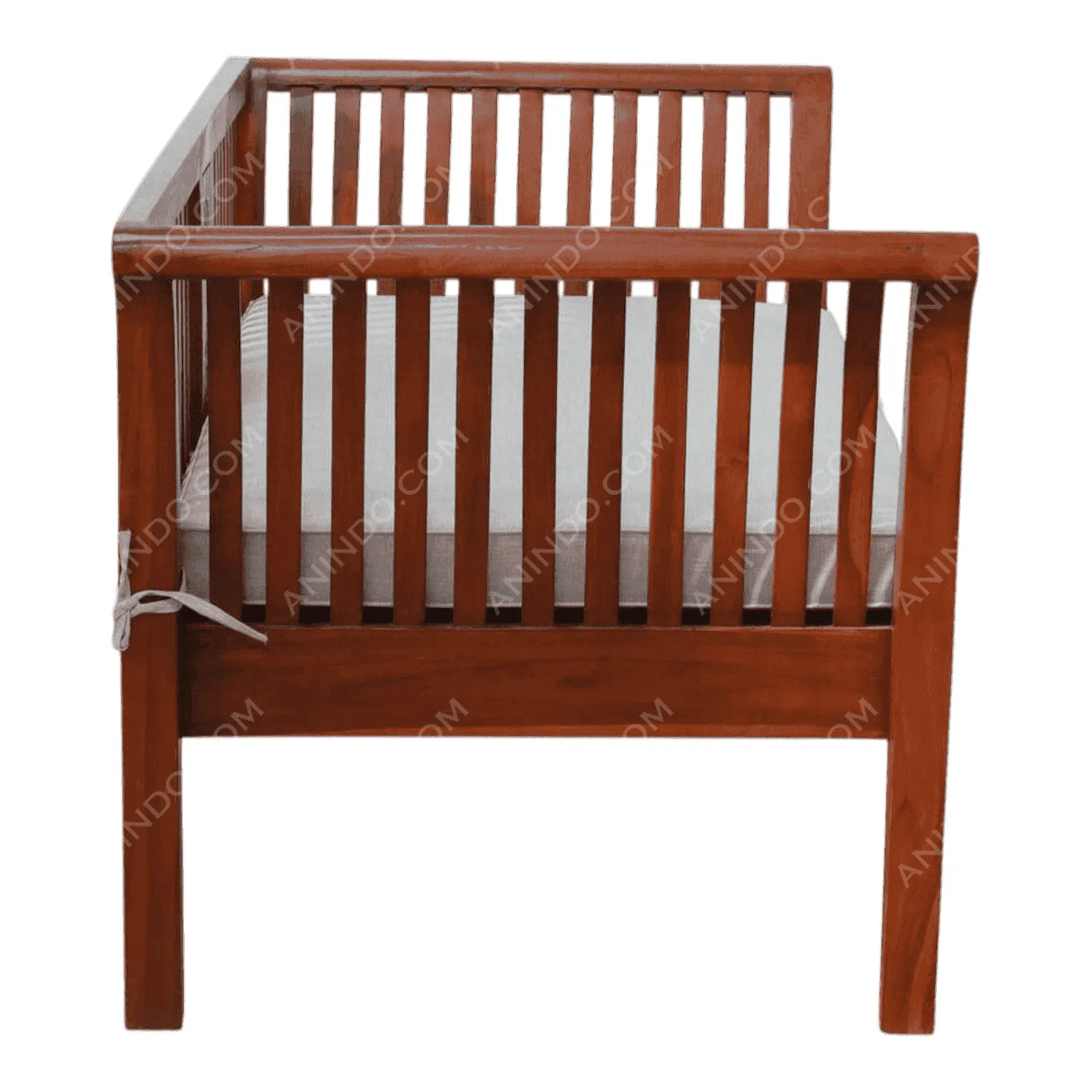 Wooden crib with slatted sides and mattress